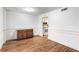 Bright dining room featuring a beautiful dark wood floor and decorative wall trim at 8827 Applegate Ln, Atlanta, GA 30350