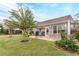 Backyard with well-manicured lawn, patio seating, and a charming garden for outdoor enjoyment at 1152 Simonton Glen Way, Lawrenceville, GA 30045