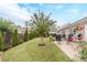 Well-maintained backyard featuring a patio, lush lawn, mature trees, and manicured landscaping at 1152 Simonton Glen Way, Lawrenceville, GA 30045