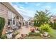 Backyard view showcases a manicured lawn, patio seating area, and a brick home exterior at 1152 Simonton Glen Way, Lawrenceville, GA 30045