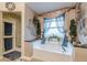 Beautiful bathroom featuring a soaking tub, shower, and blue decorative accents at 1152 Simonton Glen Way, Lawrenceville, GA 30045