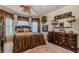 Serene bedroom with Asian themed decor and a vaulted ceiling, creating a unique space at 1152 Simonton Glen Way, Lawrenceville, GA 30045