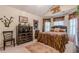 Serene bedroom with Asian themed decor and a vaulted ceiling, creating a unique space at 1152 Simonton Glen Way, Lawrenceville, GA 30045