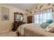 Cozy bedroom with serene decor, featuring vaulted ceilings and natural light at 1152 Simonton Glen Way, Lawrenceville, GA 30045