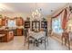 Open dining area featuring classic decor, natural light, and seamless flow with kitchen at 1152 Simonton Glen Way, Lawrenceville, GA 30045