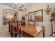 Dining room with a large table, chandelier, and wall decor at 1152 Simonton Glen Way, Lawrenceville, GA 30045