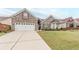 Alluring single-Gathering home featuring a neatly kept lawn and a driveway leading to a spacious two-car garage at 1152 Simonton Glen Way, Lawrenceville, GA 30045