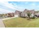 Charming single-Gathering home with a well-manicured lawn and a long driveway leading to a two-car garage at 1152 Simonton Glen Way, Lawrenceville, GA 30045
