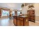 Kitchen with a large island, wooden cabinets, and adjacent dining area for easy meals at 1152 Simonton Glen Way, Lawrenceville, GA 30045