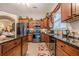 Spacious kitchen featuring dark countertops, stainless appliances, and ample cabinet space at 1152 Simonton Glen Way, Lawrenceville, GA 30045