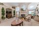 Inviting living room with a fireplace, arched alcoves, and decorative greenery at 1152 Simonton Glen Way, Lawrenceville, GA 30045