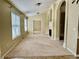 Bright, spacious living room with a fireplace, large windows, and a neutral color scheme at 1152 Simonton Glen Way, Lawrenceville, GA 30045
