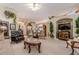 Comfortable living room featuring plush seating, decorative plants, and a mounted TV at 1152 Simonton Glen Way, Lawrenceville, GA 30045