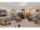Elegant living room with plush seating, ornate mirrors, and stylish decor at 1152 Simonton Glen Way, Lawrenceville, GA 30045