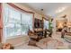 Comfortable living room featuring large windows and warm, natural light throughout the day at 1152 Simonton Glen Way, Lawrenceville, GA 30045