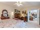 Spacious main bedroom offering ample wood furniture and an open doorway at 1152 Simonton Glen Way, Lawrenceville, GA 30045