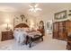 Charming main bedroom with wood furniture, and decorative floral accents at 1152 Simonton Glen Way, Lawrenceville, GA 30045