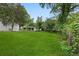 Expansive backyard with lush green grass and mature trees, perfect for outdoor activities at 1441 Ezra Church Nw Dr, Atlanta, GA 30314