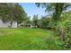Spacious backyard with green grass and mature trees, offering plenty of room for gardening at 1441 Ezra Church Nw Dr, Atlanta, GA 30314