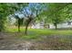 Large backyard with mature trees and a wood fence, ready for landscaping and outdoor entertainment at 1441 Ezra Church Nw Dr, Atlanta, GA 30314
