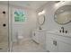 Updated bathroom with dual vanities, modern fixtures, and a glass-enclosed shower at 1441 Ezra Church Nw Dr, Atlanta, GA 30314