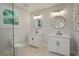 Contemporary bathroom featuring double vanity with granite counters and a glass-enclosed shower at 1441 Ezra Church Nw Dr, Atlanta, GA 30314