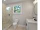 Bathroom featuring walk-in shower, commode, and vanity at 1441 Ezra Church Nw Dr, Atlanta, GA 30314