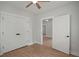Neutral bedroom featuring wood-look floors and white doors with black hardware at 1441 Ezra Church Nw Dr, Atlanta, GA 30314