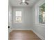 Well-lit bedroom with wood-look flooring, neutral paint, and white trim and doors at 1441 Ezra Church Nw Dr, Atlanta, GA 30314