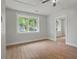 Bedroom boasting luxury vinyl plank flooring and natural light from the beautiful backyard view at 1441 Ezra Church Nw Dr, Atlanta, GA 30314