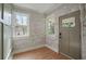 Foyer features stone accent walls, hardwood floors, a view of the front yard through two windows at 1441 Ezra Church Nw Dr, Atlanta, GA 30314