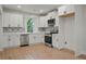 New Kitchen featuring stainless appliances, light colored countertops, and diamond pattern backsplash at 1441 Ezra Church Nw Dr, Atlanta, GA 30314