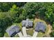 An aerial view shows the neighborhood homes, mature trees and manicured lawns at 1803 Gold Finch Way, Lawrenceville, GA 30043