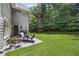 Grassy backyard with patio furniture perfect for outdoor entertaining at 1803 Gold Finch Way, Lawrenceville, GA 30043