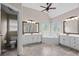 Bright bathroom with double vanities, corner tub, and separate toilet room at 1803 Gold Finch Way, Lawrenceville, GA 30043