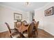 Elegant dining room with hardwood floors, and a dining table perfect for gatherings at 1803 Gold Finch Way, Lawrenceville, GA 30043