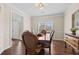 Elegant dining room with hardwood floors, stylish furniture, and ample natural light at 1803 Gold Finch Way, Lawrenceville, GA 30043