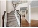 Inviting foyer showcasing hardwood floors and a staircase leading to the second floor at 1803 Gold Finch Way, Lawrenceville, GA 30043