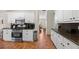 Spacious kitchen with granite countertops, stainless steel appliances, and ample cabinet space at 1803 Gold Finch Way, Lawrenceville, GA 30043