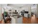 Modern kitchen with brown granite countertops, stainless steel appliances, and an breakfast bar at 1803 Gold Finch Way, Lawrenceville, GA 30043