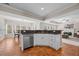 Kitchen with granite countertops and stainless steel appliances, seamlessly connecting to the dining and living areas at 1803 Gold Finch Way, Lawrenceville, GA 30043