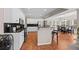Well-appointed kitchen transitions to an eating area with large windows and backyard views at 1803 Gold Finch Way, Lawrenceville, GA 30043