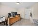 Neutral home office features a large window, desk, ample workspace, and plush carpet for added comfort at 1803 Gold Finch Way, Lawrenceville, GA 30043