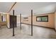 A finished basement with tile floors, natural light, and neutral paint at 4329 Cedar Valley Ln, Conley, GA 30288