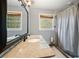A bathroom with a stone countertop vanity, tile floor and shower at 4329 Cedar Valley Ln, Conley, GA 30288