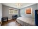 This bedroom has two windows, wood floors, and gray walls at 4329 Cedar Valley Ln, Conley, GA 30288