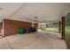 Exterior shot of a carport with a brick support beam and concrete floor at 4329 Cedar Valley Ln, Conley, GA 30288