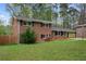 Charming two-story brick home with a well-maintained lawn and classic black shutters at 4329 Cedar Valley Ln, Conley, GA 30288