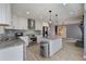 Renovated kitchen with stainless steel appliances, granite counters, and a stylish center island at 4329 Cedar Valley Ln, Conley, GA 30288