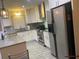 Functional kitchen featuring stainless steel appliances, ample storage, and a convenient layout at 4329 Cedar Valley Ln, Conley, GA 30288